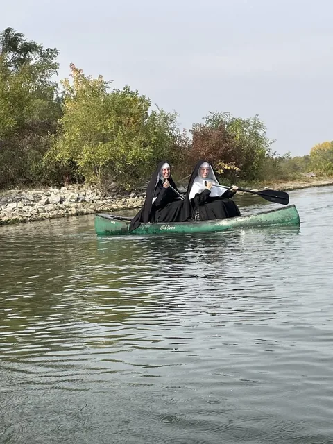 Sisters canoeing together.