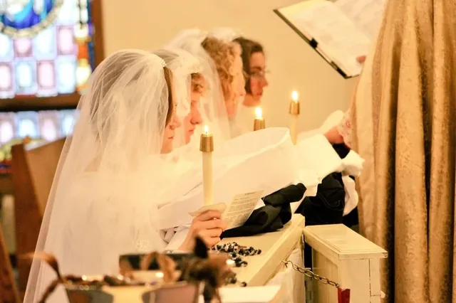 Candidates at the communion rail during a ceremony of religious reception.